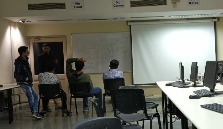 Tarang discussing NLP stuff with friends